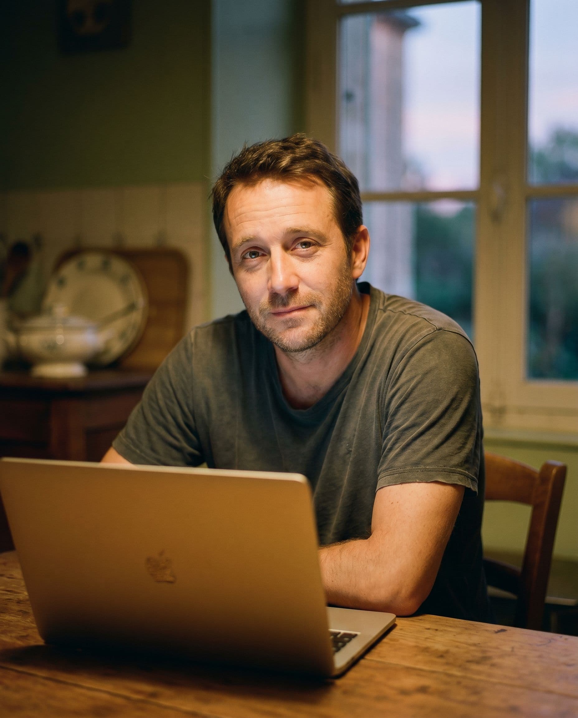 Portrait of a tired man at night, in front of his laptop